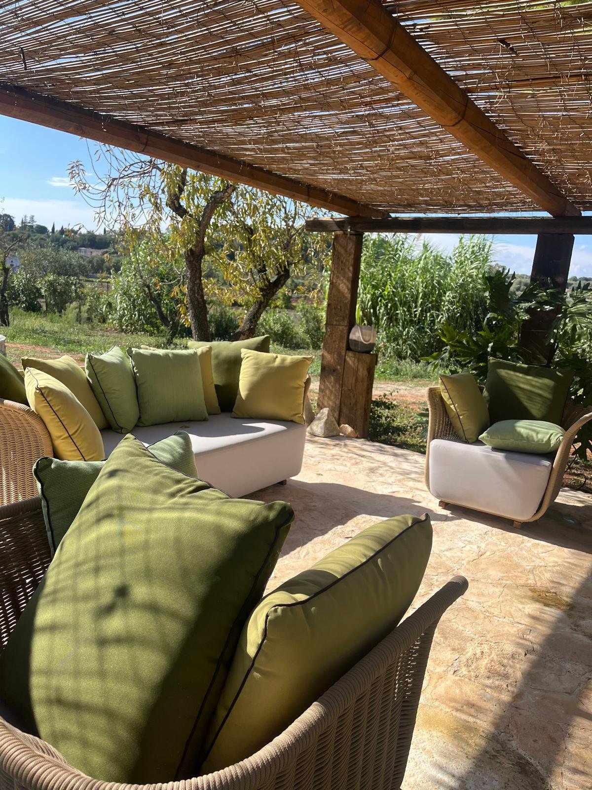 Outdoor lounge under the pergola at Masseria Bel Cortile